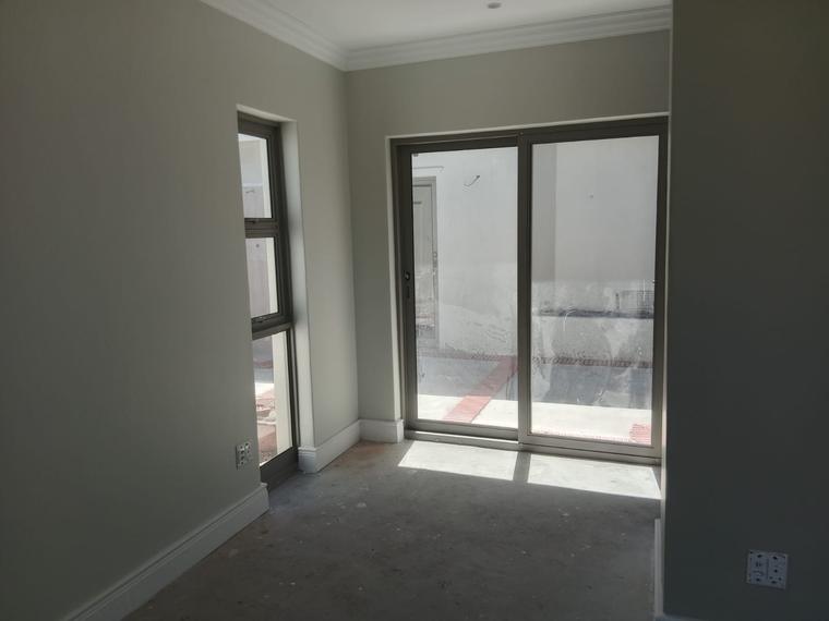 Painted bedroom with cornices, skirting and aluminium sliding doors
