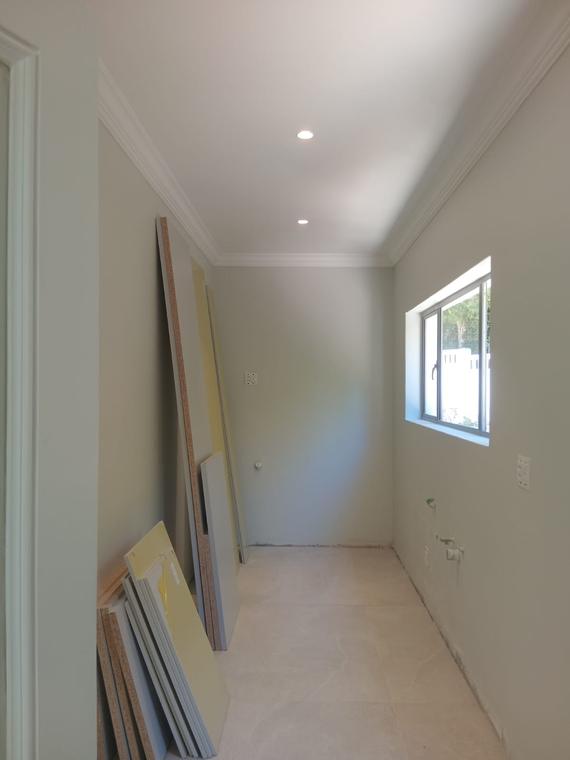 Scullery painted and tiled with plumbing points set out for appliances