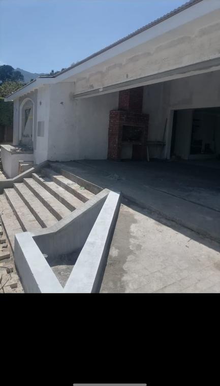 Newly cast patio, steps and built-in braai under a covered stoep